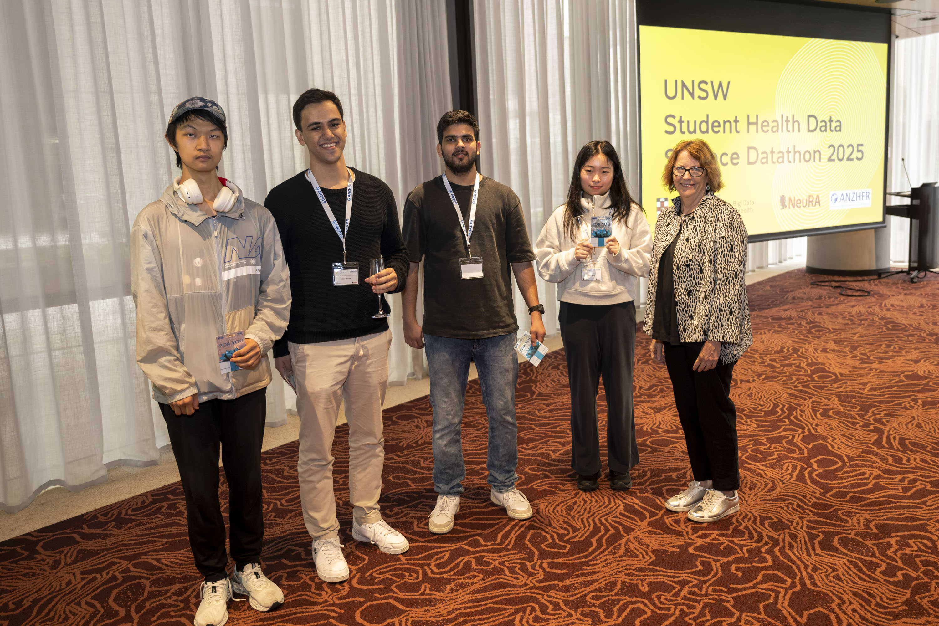 Third Place: Jiahui Di, Oliver D’Souza, Ishu Rajput, Corin Zhang and Professor Cheryl Jones (Dean, Faculty of Medicine and Health). Not pictured: Jason Setiadi Credit: Cassandra Hannagan